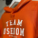 Damen Hoodie "Team Usedom" | Orange - INSELLIEBE USEDOM